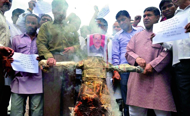 Congress activists burn an effigy of Madhya Pradesh Chief Minister Shivraj Singh Chouhan, demanding for a CBI investigation into the deaths in Vyapam scam (Photo: PTI) Congress activists burn an effigy of Madhya Pradesh Chief Minister Shivraj Singh Chouhan, demanding for a CBI investigation into the deaths in Vyapam scam (Photo: PTI)